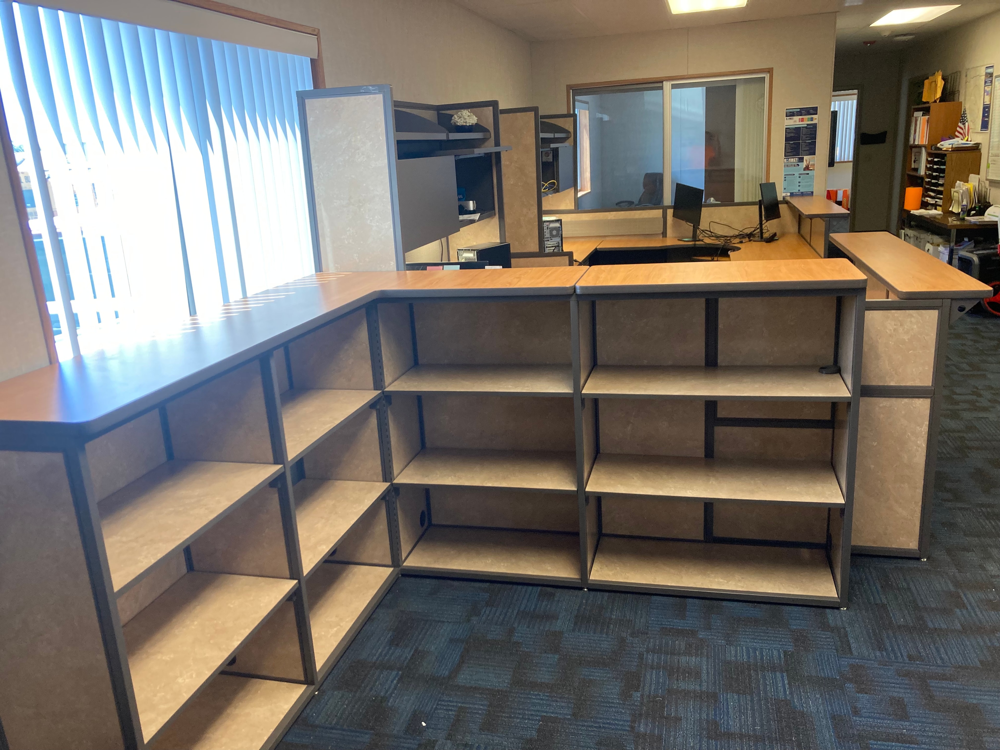 School office reception area shelving and workstation installation